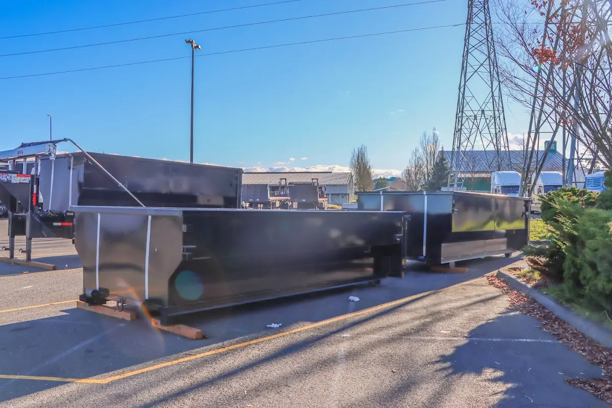 Roll-off dumpster ready for waste disposal at job site for Concrete Dumpster Rental in South Hadley